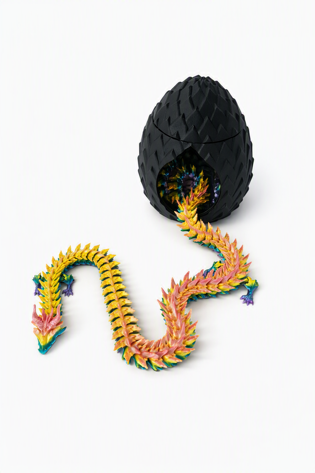 Rainbow dragon emerging from a black dragon egg